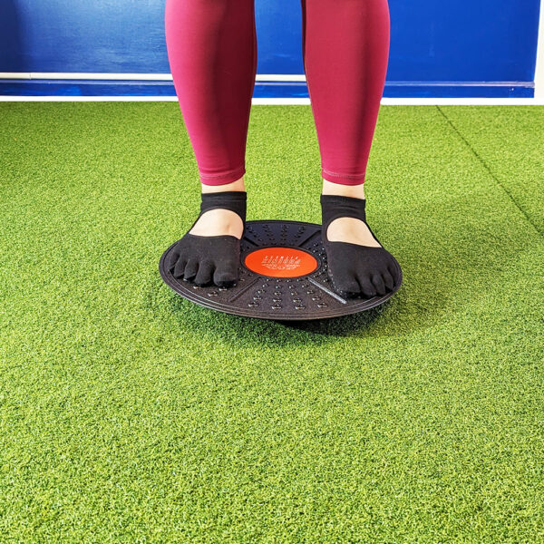 Phoenix Fitness Balance board preparing to be used for squat warm up.