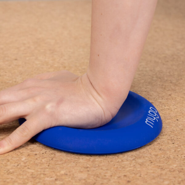 Lifestyle of blue yoga jelly support pad in use with a hand