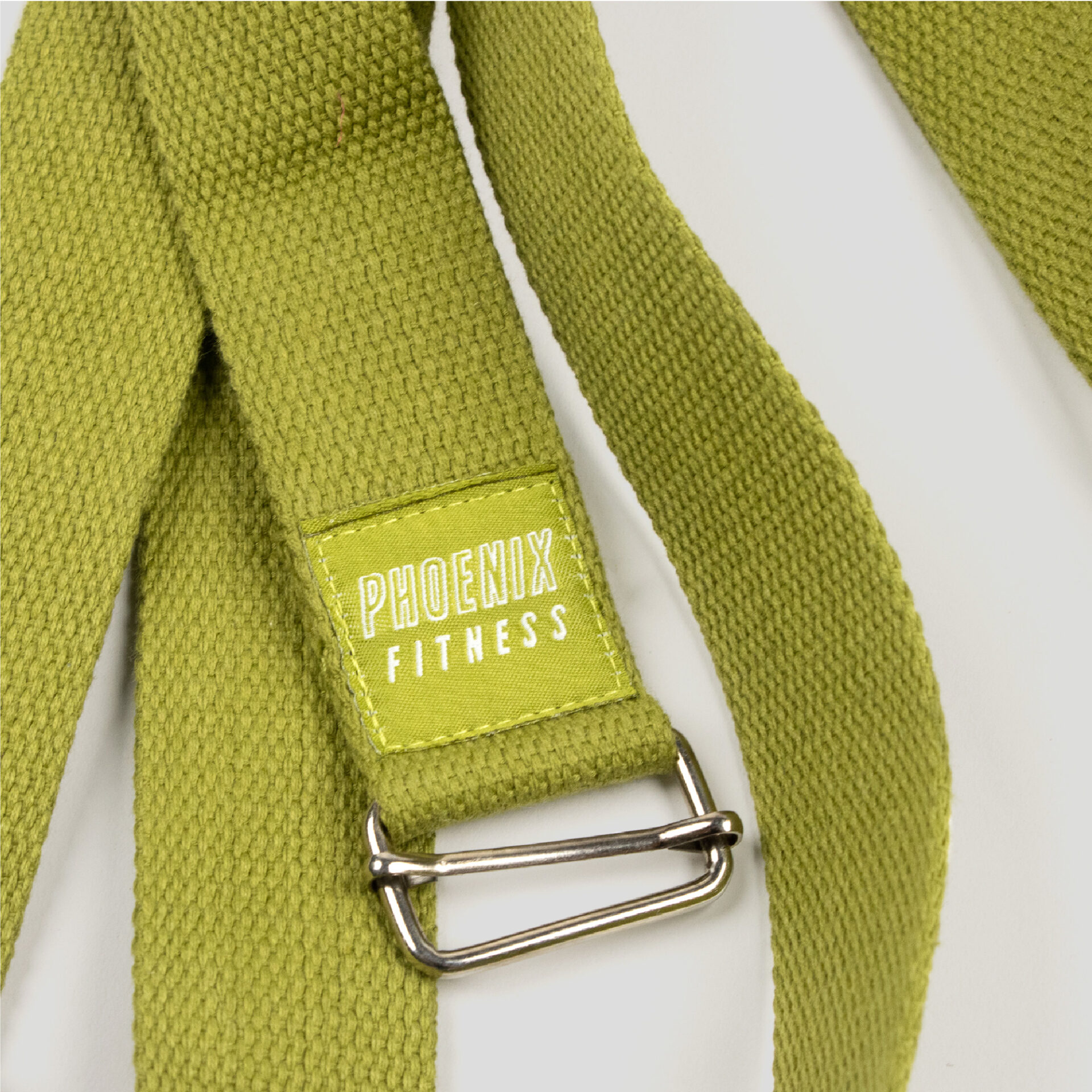Close up of the buckle & d-ring on the green yoga strap