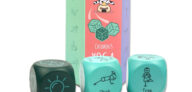 The three children's yoga dice is position infront of the packaging