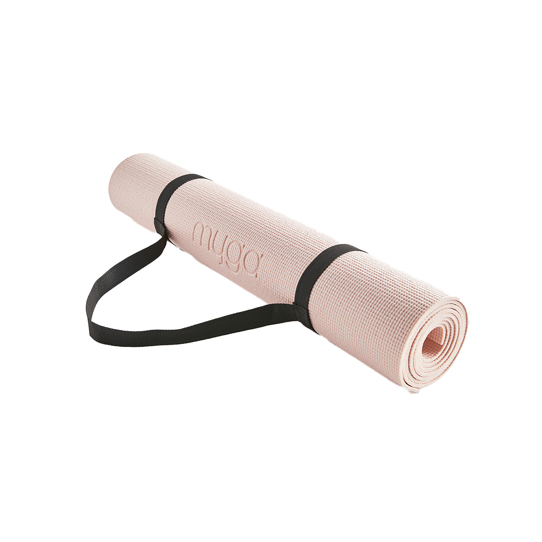 Rolled pink yoga mat with black carry strap included