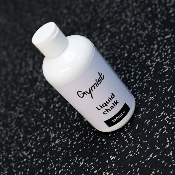 Liquid Chalk 250ml bottle on the gym floor