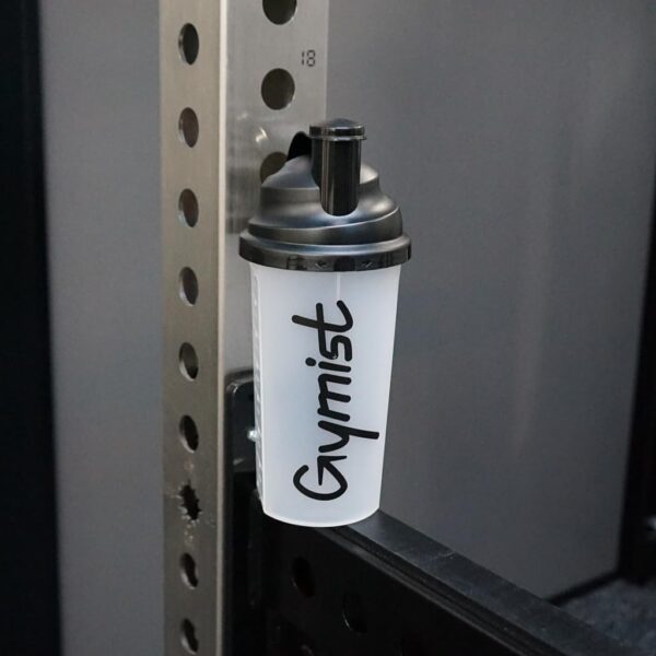 Protein shaker sat on a squat rack
