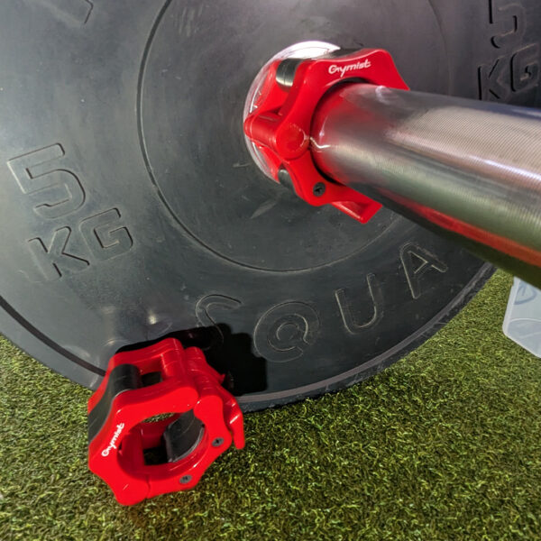 Red Gymist 2 inch Olympic barbell collars, showing how well they contrast black bumper plates
