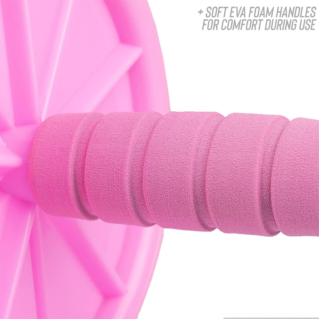 Close-up of the soft foam handle on a pink abdominal roller for a comfortable grip during core workouts.