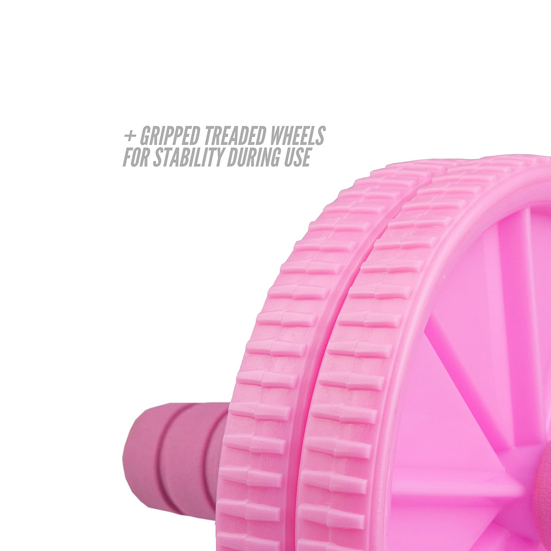 Close-up of the gripped dual wheels on a pink ab roller, designed to provide added stability during core exercises.