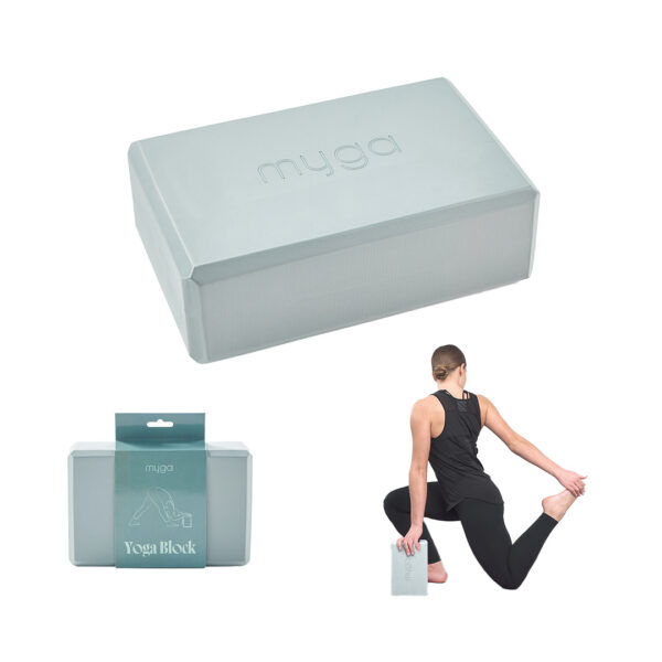 Teal yoga block used for stretching and support in yoga pose