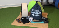 Affordable coach-approved gym accessories UK, including Gymist weightlifting straps, fun fitness dice, Myga yoga wheel, and RDX skipping rope on turf in the Buds Fitness, private personal training studio