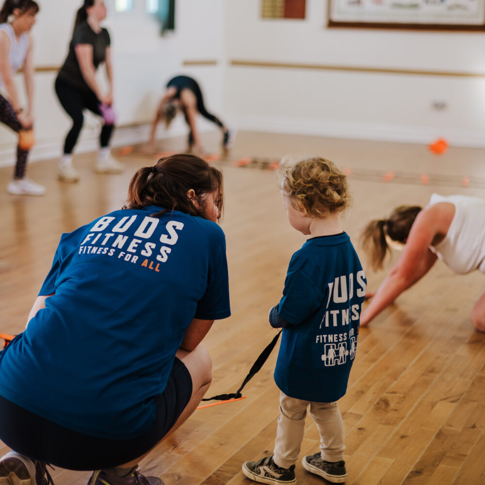 Coach Abbie of Buds Fitness working with children, to help mum's get active