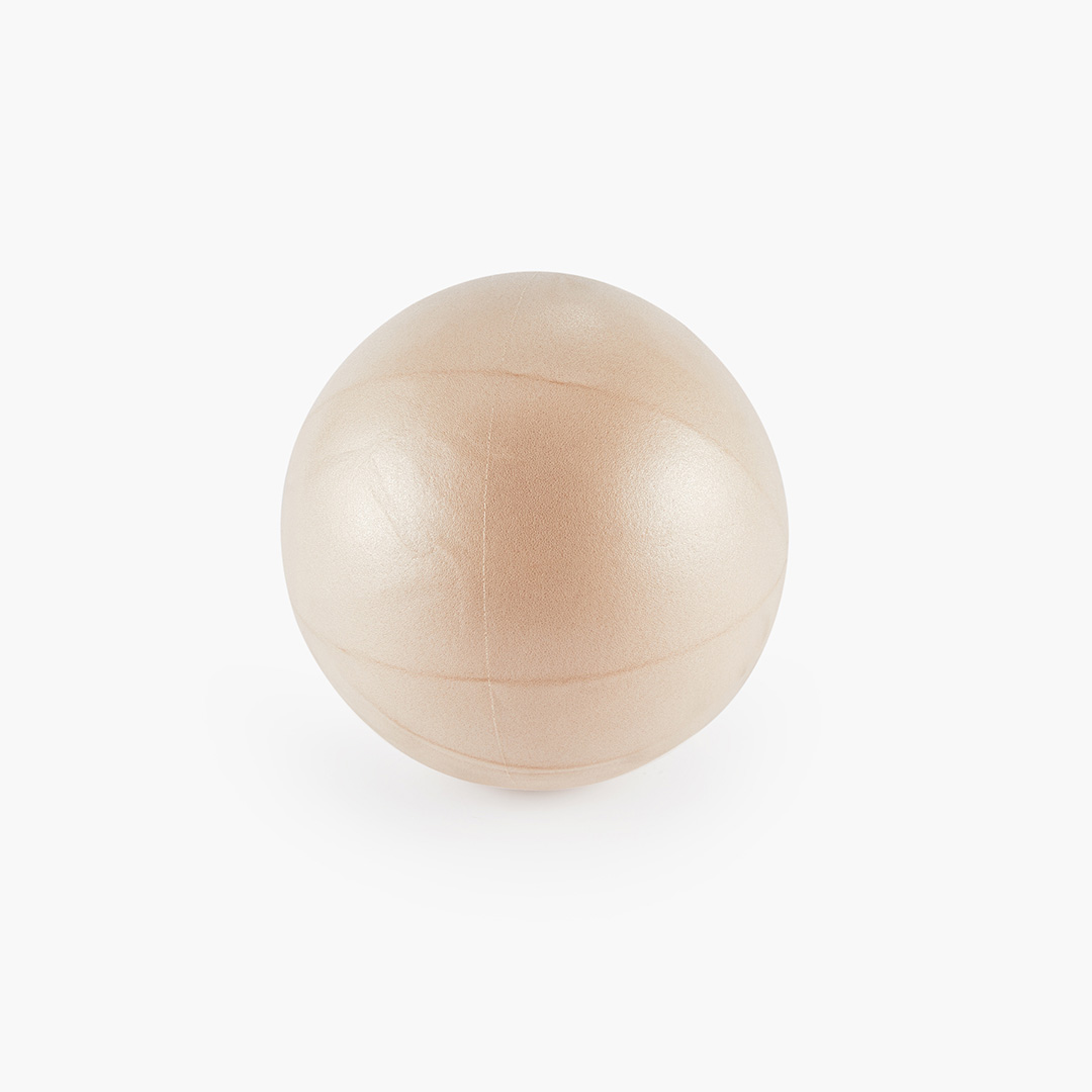 Cream Pilates Ball for core strength and balance exercises