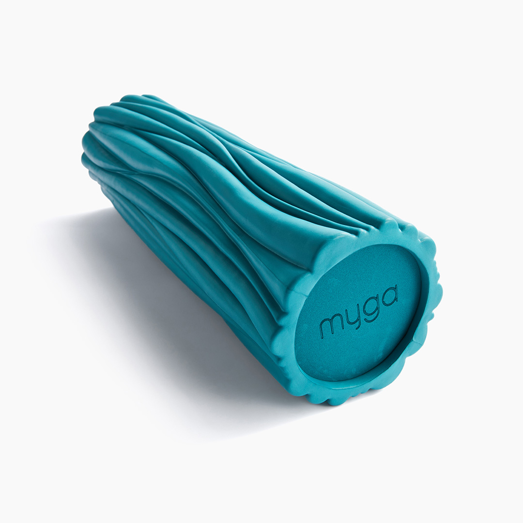 Close-up of the Myga Wave Foam Roller in teal featuring textured wave-pattern surface for targeted muscle massage.