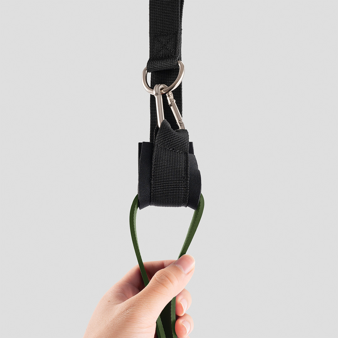 Door anchor attachment connected to army green pull-up resistance band