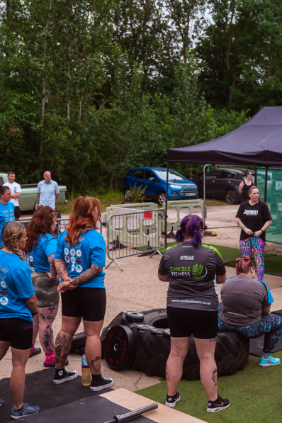 Image shows a crowd of athletes listening to the rules meeting at a Buds Fitness promoted event.