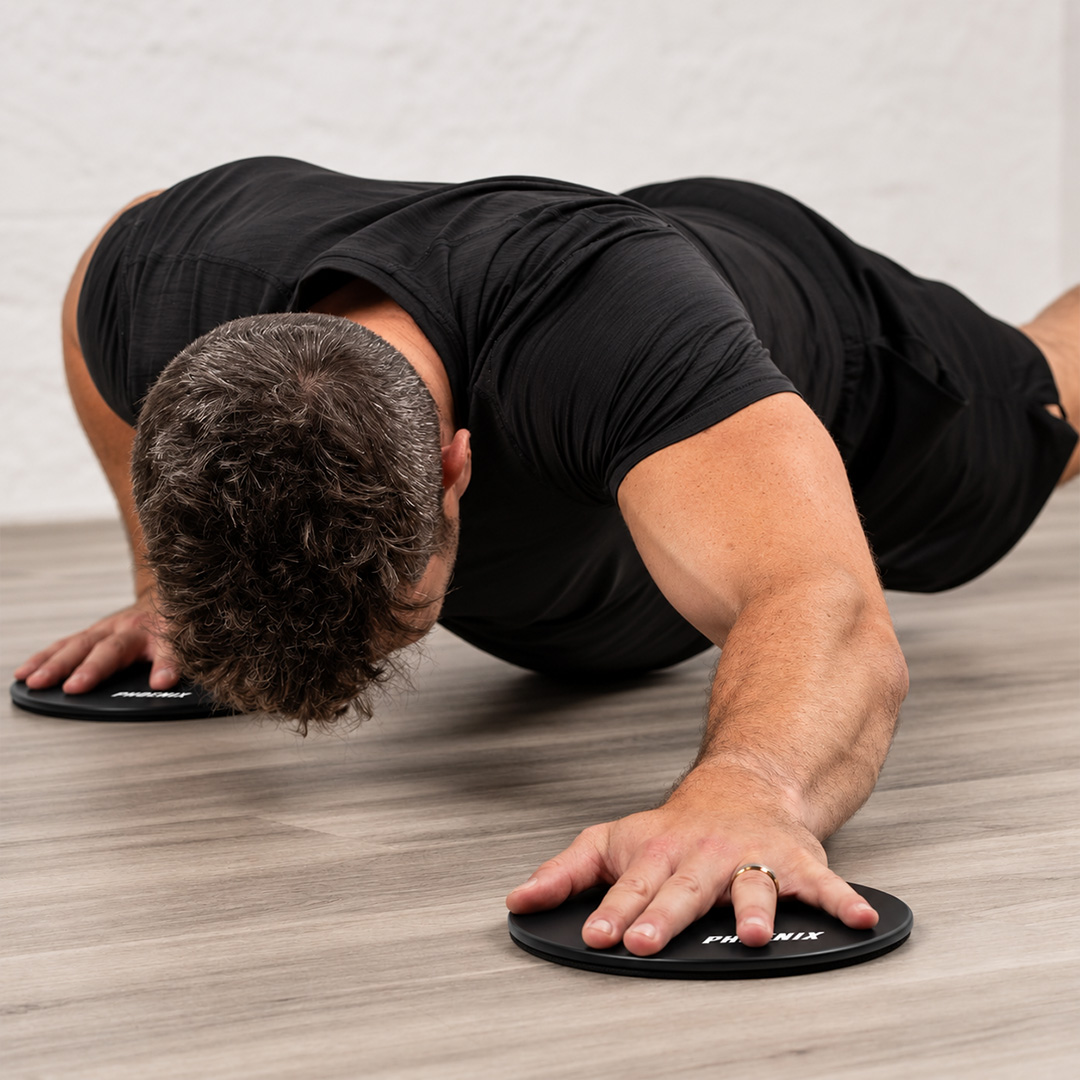 Black core sliders used for a sliding push-up and core workout